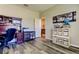 Versatile bedroom featuring wood-look flooring, a large window and plenty of natural light at 6648 Castle Green Pl, Zephyrhills, FL 33541