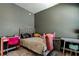 Charming bedroom featuring a desk, bed, and modern decor at 6648 Castle Green Pl, Zephyrhills, FL 33541