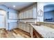 This kitchen features granite countertops, stainless steel appliances, and ample cabinet space at 6648 Castle Green Pl, Zephyrhills, FL 33541
