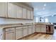 This open kitchen features granite countertops and plenty of cabinet space at 6648 Castle Green Pl, Zephyrhills, FL 33541