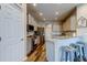 Modern kitchen featuring stainless steel appliances, granite countertops, and an eat-in breakfast bar at 6648 Castle Green Pl, Zephyrhills, FL 33541