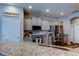 Bright kitchen featuring granite countertops, stainless steel appliances, and a convenient pantry at 6648 Castle Green Pl, Zephyrhills, FL 33541