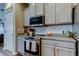 This kitchen features granite countertops, stainless steel appliances, and subway tile backsplash at 6648 Castle Green Pl, Zephyrhills, FL 33541