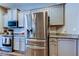This kitchen features granite countertops and stainless steel appliances at 6648 Castle Green Pl, Zephyrhills, FL 33541