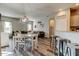 Bright and open living space with dining area, kitchen bar, and comfortable seating at 6648 Castle Green Pl, Zephyrhills, FL 33541