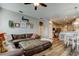 Spacious living area with a large sectional sofa, decor, and easy access to the kitchen and dining area at 6648 Castle Green Pl, Zephyrhills, FL 33541