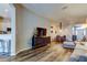 Spacious living area featuring modern flooring, a TV console, and open layout at 6648 Castle Green Pl, Zephyrhills, FL 33541