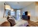 Comfortable living room featuring a plush sofa, neutral tones, and contemporary decor at 6648 Castle Green Pl, Zephyrhills, FL 33541