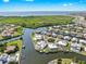 Scenic aerial view of a waterfront community with luxurious homes, canals, and stunning waterfront vistas at 718 Pinckney Dr, Apollo Beach, FL 33572