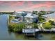 Aerial view of the property with a pool, boat dock, and waterfront access at 718 Pinckney Dr, Apollo Beach, FL 33572