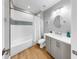 This bathroom features a shower-tub combo, a modern vanity and neutral decor at 718 Pinckney Dr, Apollo Beach, FL 33572