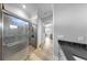 Beautiful bathroom with a large glass shower, stone flooring and mosaic tile accents at 718 Pinckney Dr, Apollo Beach, FL 33572