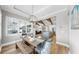 Inviting dining room with open floor plan view into kitchen and living room at 718 Pinckney Dr, Apollo Beach, FL 33572
