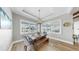Cozy dining area with wooden table, bench seating, and sunlit window views at 718 Pinckney Dr, Apollo Beach, FL 33572