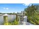 Private boat dock with a boat lift, perfect for waterfront living at 718 Pinckney Dr, Apollo Beach, FL 33572