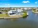 Gorgeous exterior view of waterfront home with pool, patio and boat dock at 718 Pinckney Dr, Apollo Beach, FL 33572