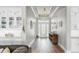 Grand foyer with hardwood floors, tray ceiling, decorative lighting, and built in hutch at 718 Pinckney Dr, Apollo Beach, FL 33572