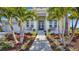 Charming front entrance with lush landscaping and a welcoming walkway at 718 Pinckney Dr, Apollo Beach, FL 33572