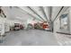 Spacious three-car garage with ample storage and golf cart at 718 Pinckney Dr, Apollo Beach, FL 33572