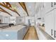 Modern kitchen featuring an island with seating, stainless steel appliances and white cabinets and natural light at 718 Pinckney Dr, Apollo Beach, FL 33572