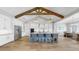 Bright, spacious kitchen with stainless appliances, a large island, and a wooden beam ceiling at 718 Pinckney Dr, Apollo Beach, FL 33572