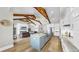 Well-appointed kitchen with island seating, stainless steel appliances, and an open floor plan to the living area at 718 Pinckney Dr, Apollo Beach, FL 33572