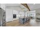 Modern kitchen with stainless steel appliances, white cabinets, and a large center island with bar stool seating at 718 Pinckney Dr, Apollo Beach, FL 33572