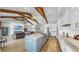 Open concept kitchen with a large island, breakfast bar, modern appliances, and an adjacent living area at 718 Pinckney Dr, Apollo Beach, FL 33572