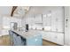 Modern kitchen with a center island, stainless steel appliances, and elegant cabinetry for a sleek design at 718 Pinckney Dr, Apollo Beach, FL 33572
