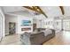 Comfortable living room with a fireplace, hardwood floors, built-ins, and an open-concept floor plan at 718 Pinckney Dr, Apollo Beach, FL 33572
