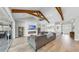 Spacious living room featuring vaulted ceilings with beams, a fireplace, and an open floor plan at 718 Pinckney Dr, Apollo Beach, FL 33572