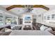 Cozy living room with fireplace, large sliding doors, and comfortable furniture at 718 Pinckney Dr, Apollo Beach, FL 33572