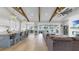 Bright open living space with kitchen island, dining area, and a living room with a cozy fireplace at 718 Pinckney Dr, Apollo Beach, FL 33572