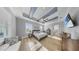 Serene main bedroom featuring a trey ceiling, sitting area, and ample natural light at 718 Pinckney Dr, Apollo Beach, FL 33572
