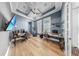 Home office features wood floors, blue walls, recessed lights and a ceiling fan at 718 Pinckney Dr, Apollo Beach, FL 33572