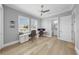 Bright office space with hardwood floors, two windows, and built-in desks at 718 Pinckney Dr, Apollo Beach, FL 33572