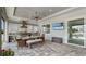 Covered patio with outdoor kitchen, dining table, and stainless steel appliances at 718 Pinckney Dr, Apollo Beach, FL 33572