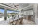 Beautiful outdoor kitchen and dining area with waterfront view at 718 Pinckney Dr, Apollo Beach, FL 33572