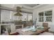 Gourmet outdoor kitchen with stainless steel appliances and a dining table at 718 Pinckney Dr, Apollo Beach, FL 33572