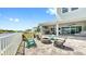 Relaxing outdoor patio with fire pit and comfortable seating overlooking the water at 718 Pinckney Dr, Apollo Beach, FL 33572