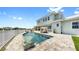 Lovely backyard featuring a pool, lounge seating, and lush greenery at 718 Pinckney Dr, Apollo Beach, FL 33572