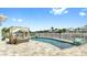 Relax poolside with lounge seating and a beautiful view of the waterfront at 718 Pinckney Dr, Apollo Beach, FL 33572