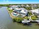 Waterfront home with a private boat dock, lift, pool, and an expansive backyard ideal for entertaining at 718 Pinckney Dr, Apollo Beach, FL 33572