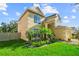 Beautiful two-story home with vibrant landscaping, lush green lawn, and a welcoming, sunny facade at 7711 Nottinghill Sky Dr, Apollo Beach, FL 33572