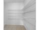 Well-organized pantry with adjustable wire shelving, maximizing storage space for a variety of kitchen essentials at 7711 Nottinghill Sky Dr, Apollo Beach, FL 33572