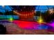 Screened pool with colored lights and string lights at 7711 Nottinghill Sky Dr, Apollo Beach, FL 33572