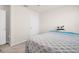 Cozy bedroom with neutral walls, carpeted floor, and ample natural light at 7774 Sail Clover Ln, Zephyrhills, FL 33540