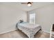 Neutral guest bedroom with a ceiling fan and carpet flooring at 7774 Sail Clover Ln, Zephyrhills, FL 33540