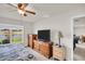 Bedroom features large window with a view of the lake at 7774 Sail Clover Ln, Zephyrhills, FL 33540