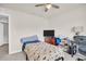 Bedroom with ceiling fan and adjacent desk area at 7774 Sail Clover Ln, Zephyrhills, FL 33540